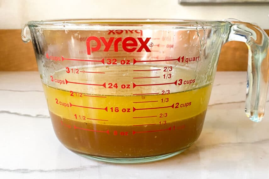 Turkey drippings in a measuring cup. Get ready to separate the fat on top from the drippings below.