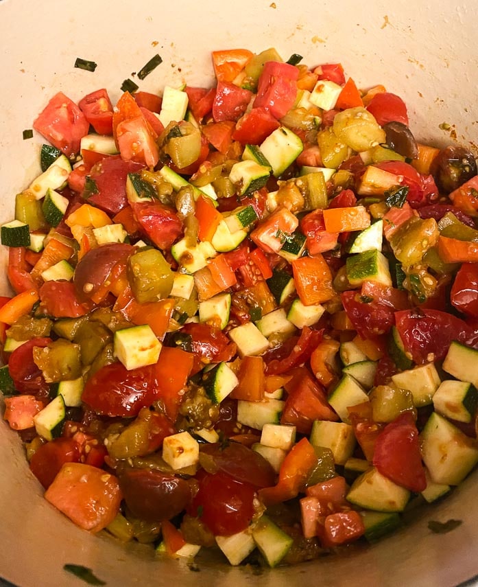 tomatoes-and-zucchini-stirred-into-eggplant-cooking-in-a-Dutch-oven