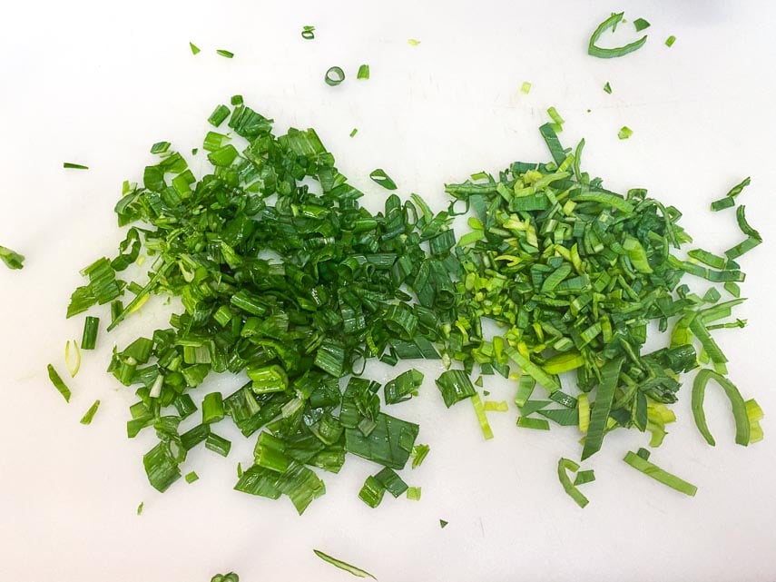 chopped-scallion-and-leek-greens-on-white-chopping-board