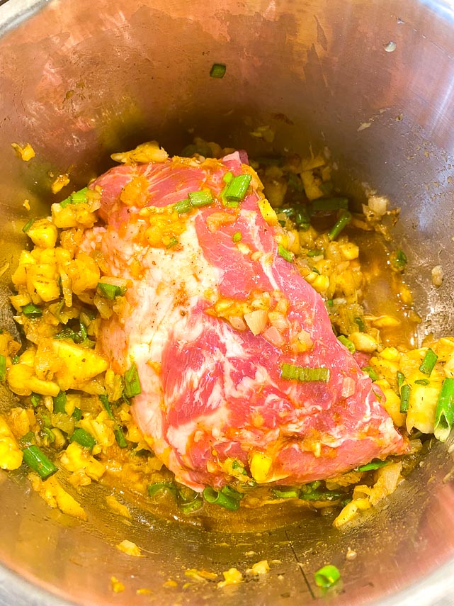 pork-added-to-Instant-Pot-with-pineapple-and-scallions