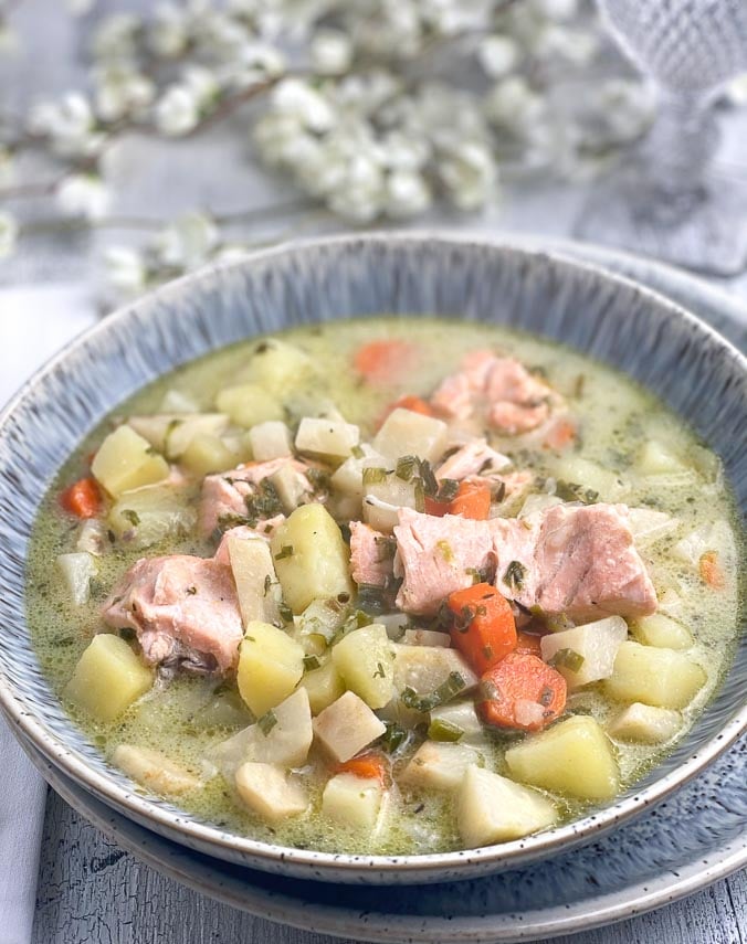 closeup-of-salmon-chowder-in-grey-ceramic-bowl