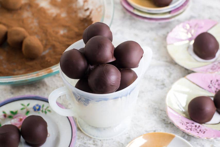 low FODMAP chocolate dipped truffles in a white dish