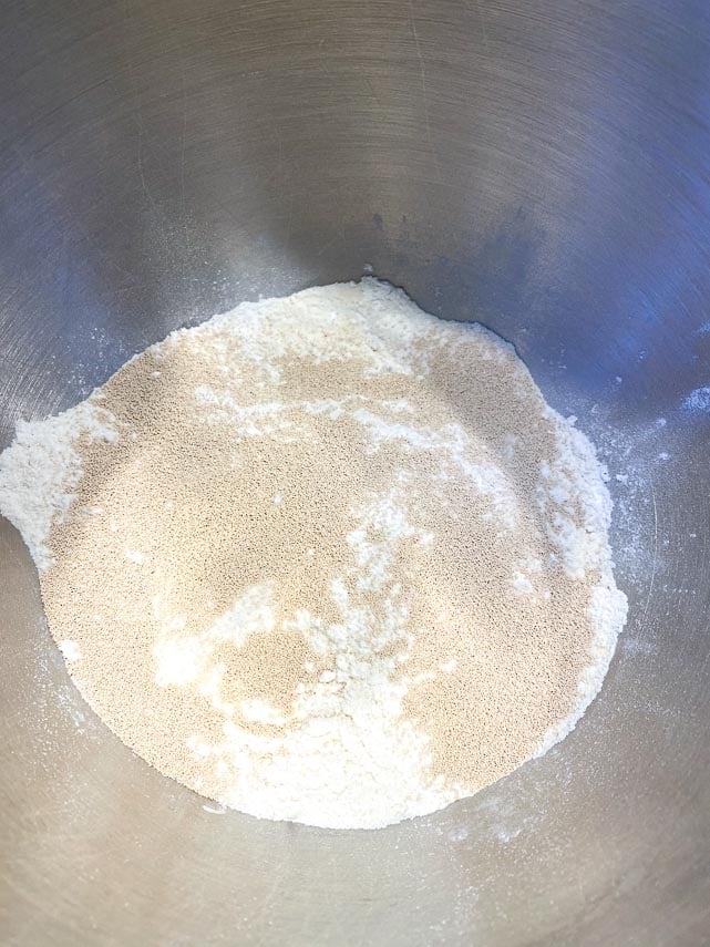 dry ingredients for pizza in mixing bowl