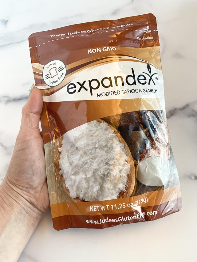 holding bag of Expandex over a white counter