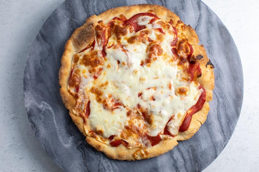 overhead image of low FODMAP Pizza 2.0 on marble round