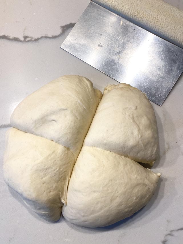 Dividing Neapolitan pizza dough into 4 equal pieces