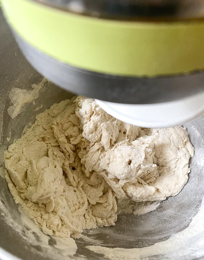 Neapolitan pizza dough in the process of mixing in stand mixer