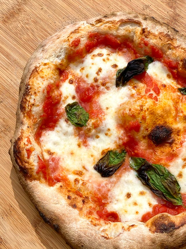 Neapolitan style pizza on wooden board