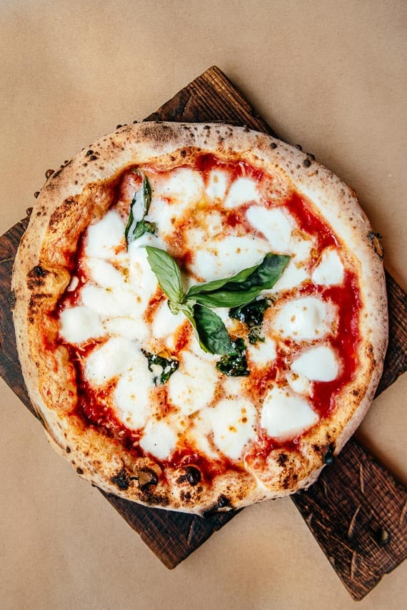neapolitan style pizza on wooden board