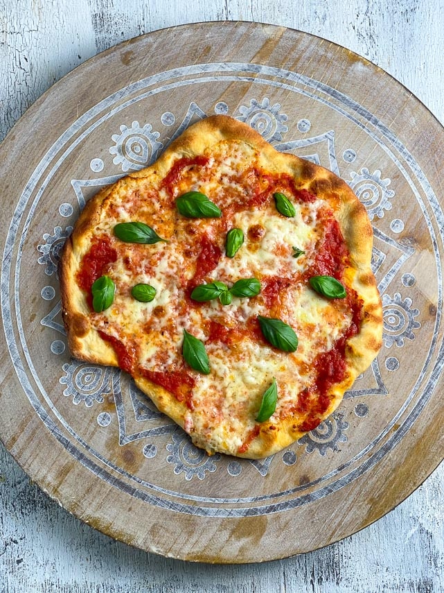 tomato, cheese pizza with fresh basil; Easy low FODMAP crust on decorative wooden board