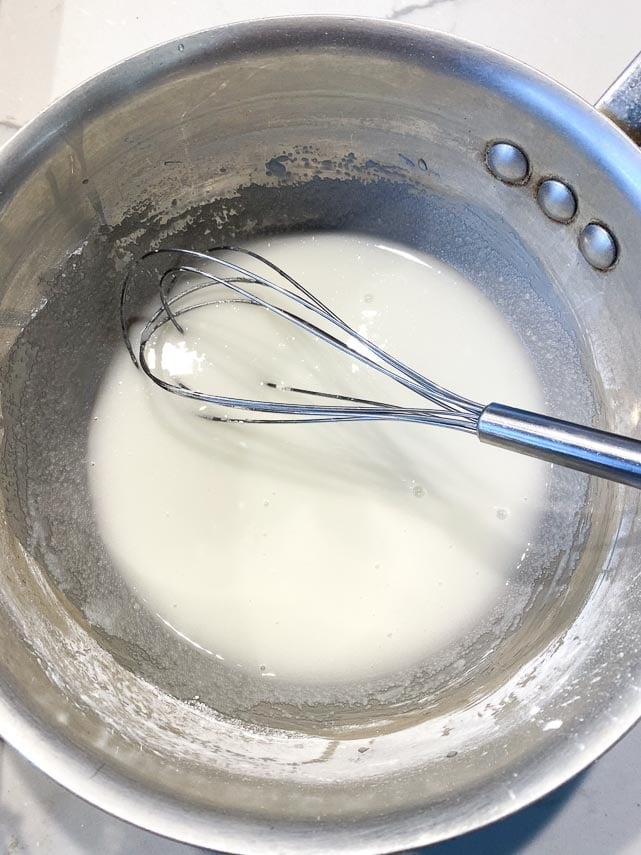 whisking cornstarch sugar and water together in saucepan