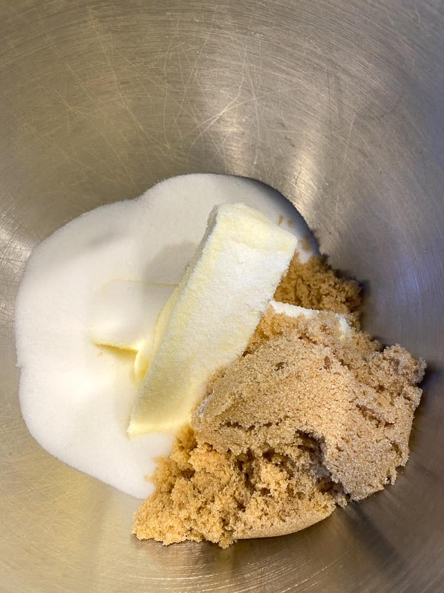 butter, sugar and brown sugar in bowl