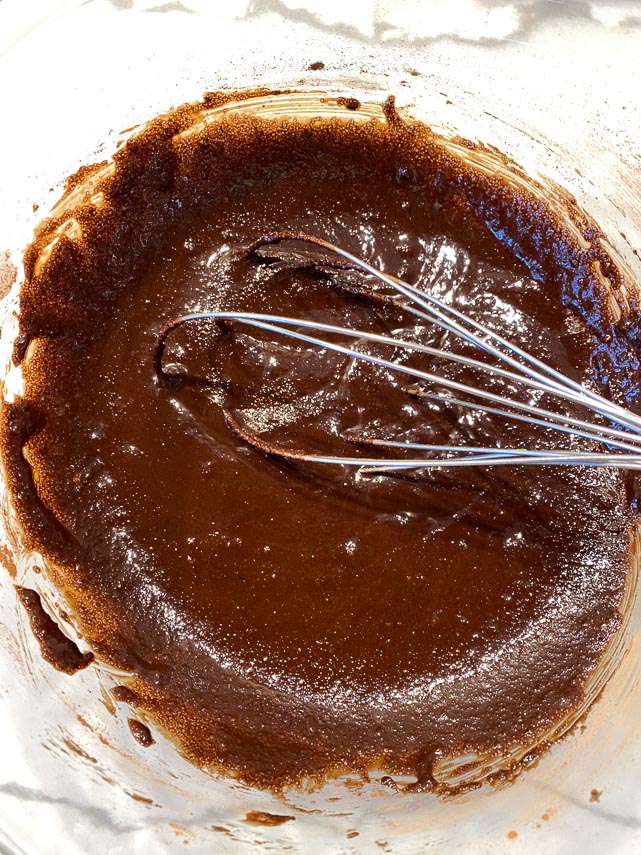cocoa, butter and sugar whisked together in glass bowl