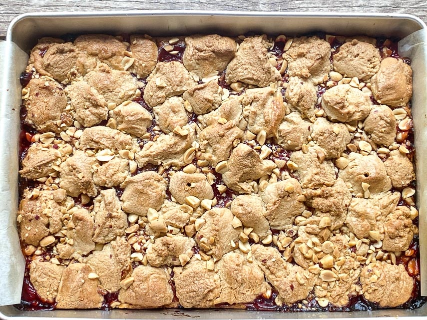 peanut butter and jelly bars baked in pan, just out of oven