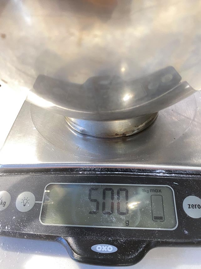 weighing out 500 g of flour on scale