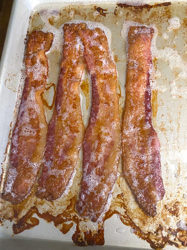 Cooked bacon on sheet pan