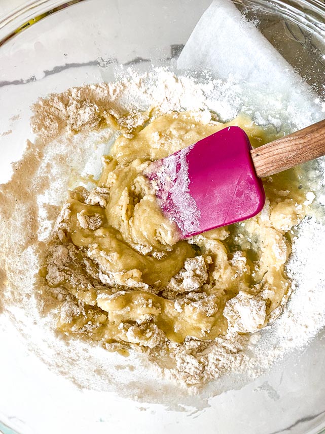 incorporating flour into butter and sugar to make lemon bar crust