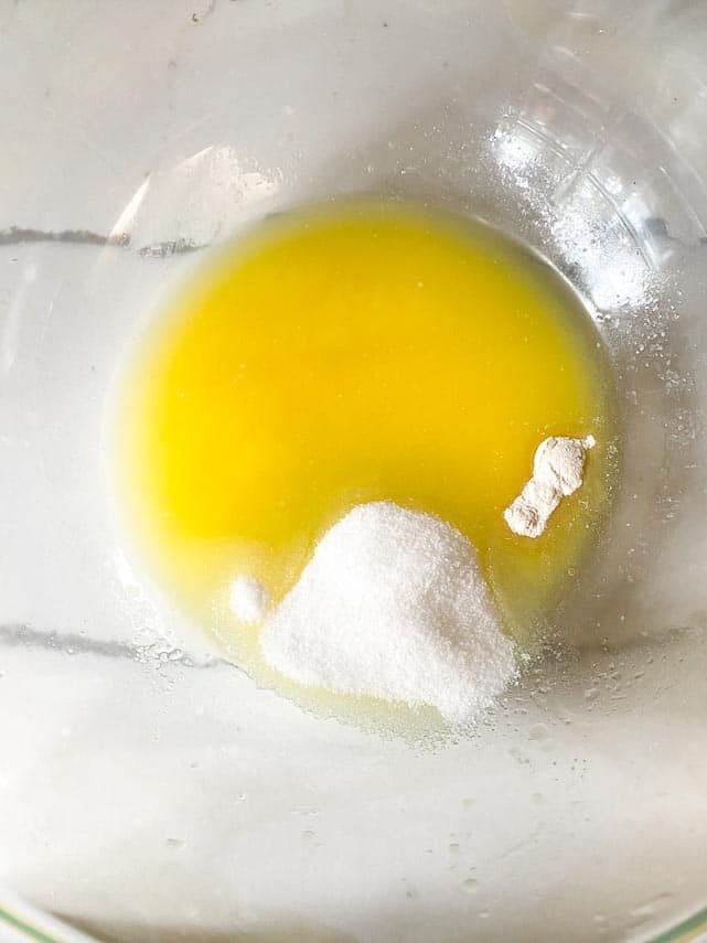 melted butter, sugar, salt and xanthan gum in glass bowl