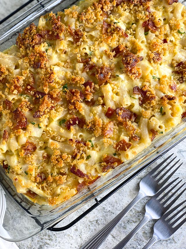 overhead image of Low FODMAP Chicken & Bacon Ranch Mac and Cheese in glass dish, forks alongside