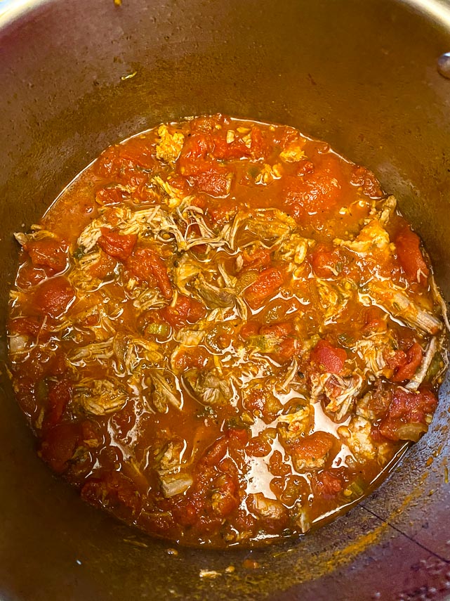 shredded pork added back to Instant Pot for Pork ragu, in tomato based sauce