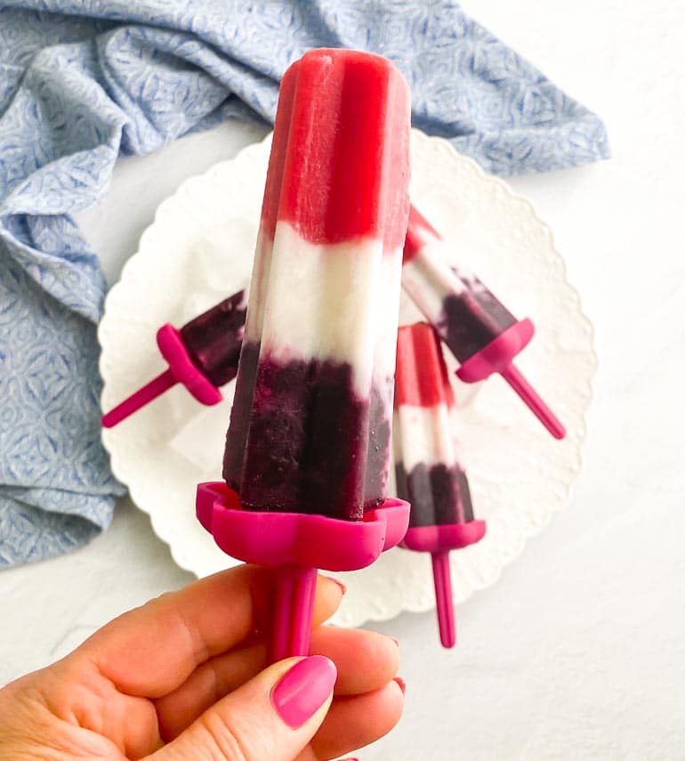 vegan red, white and blue pop held in hand