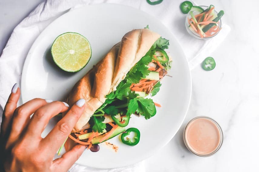 Low FODMAP Tofu Bánh Mì sandwich on white plate