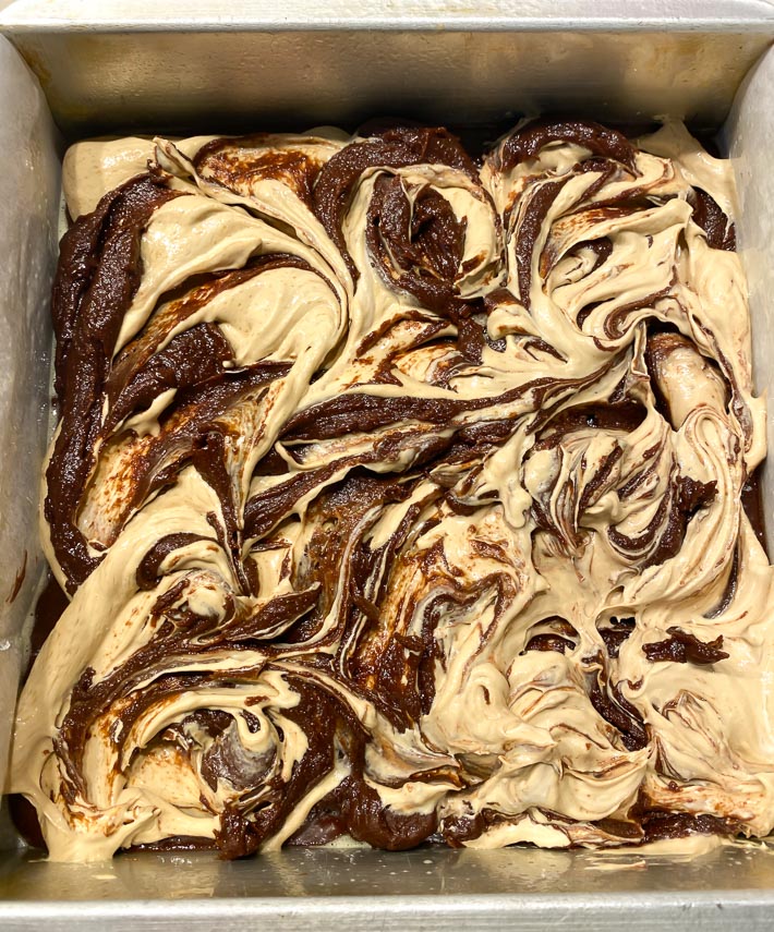 espresso cream cheese and brownie batter swirled together in square pan
