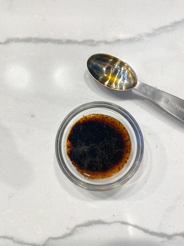 espresso powder in vanilla extract in glass bowl