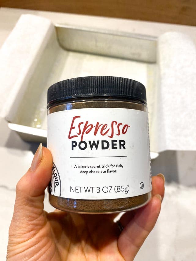 espresso powder jar held in hand