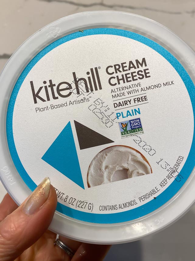 kite hill cream cheese container held in hand