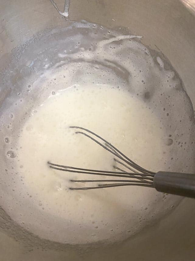 marshmallow meringue mixture in bowl with whisk