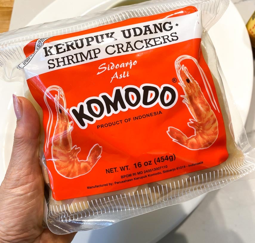 Komodo brand shrimp crackers held in hand
