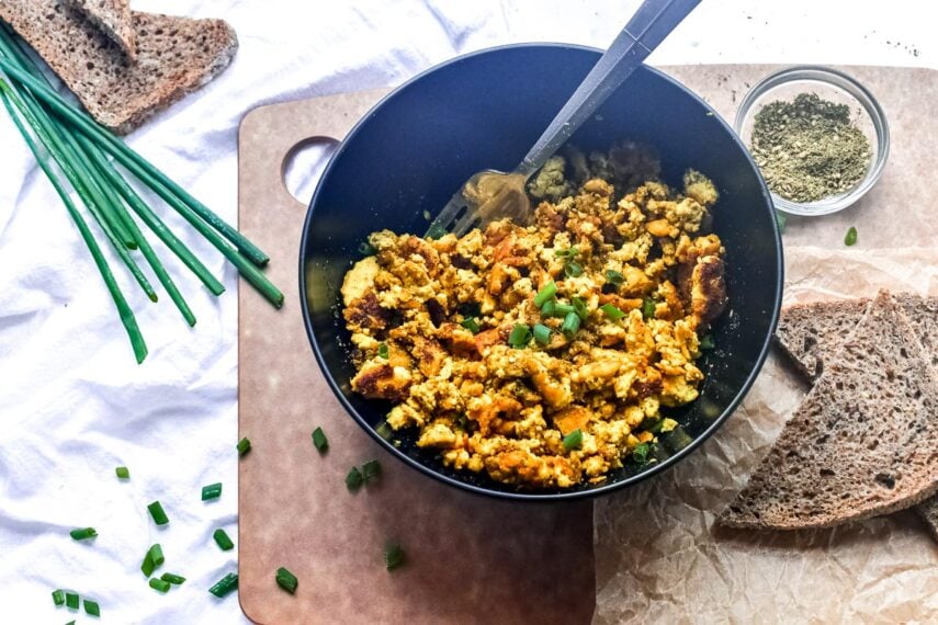 Low FODMAP Tofu Scramble in dark bowl with fork