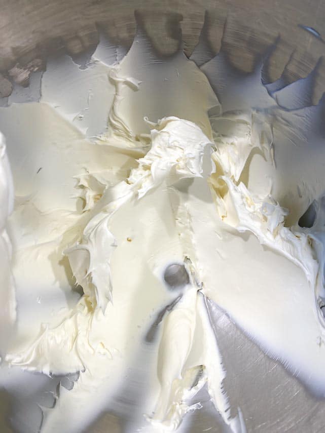 cream cheese frosting in mixer bowl