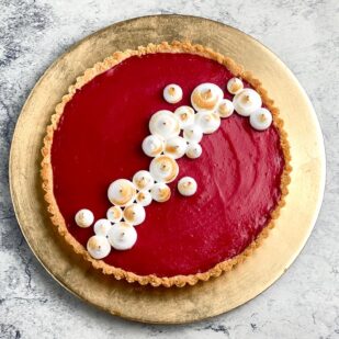 overhead low FODMAP Cranberry Curd tart on gold plate
