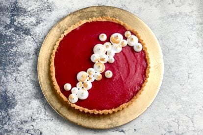 overhead low FODMAP Cranberry Curd tart on gold plate