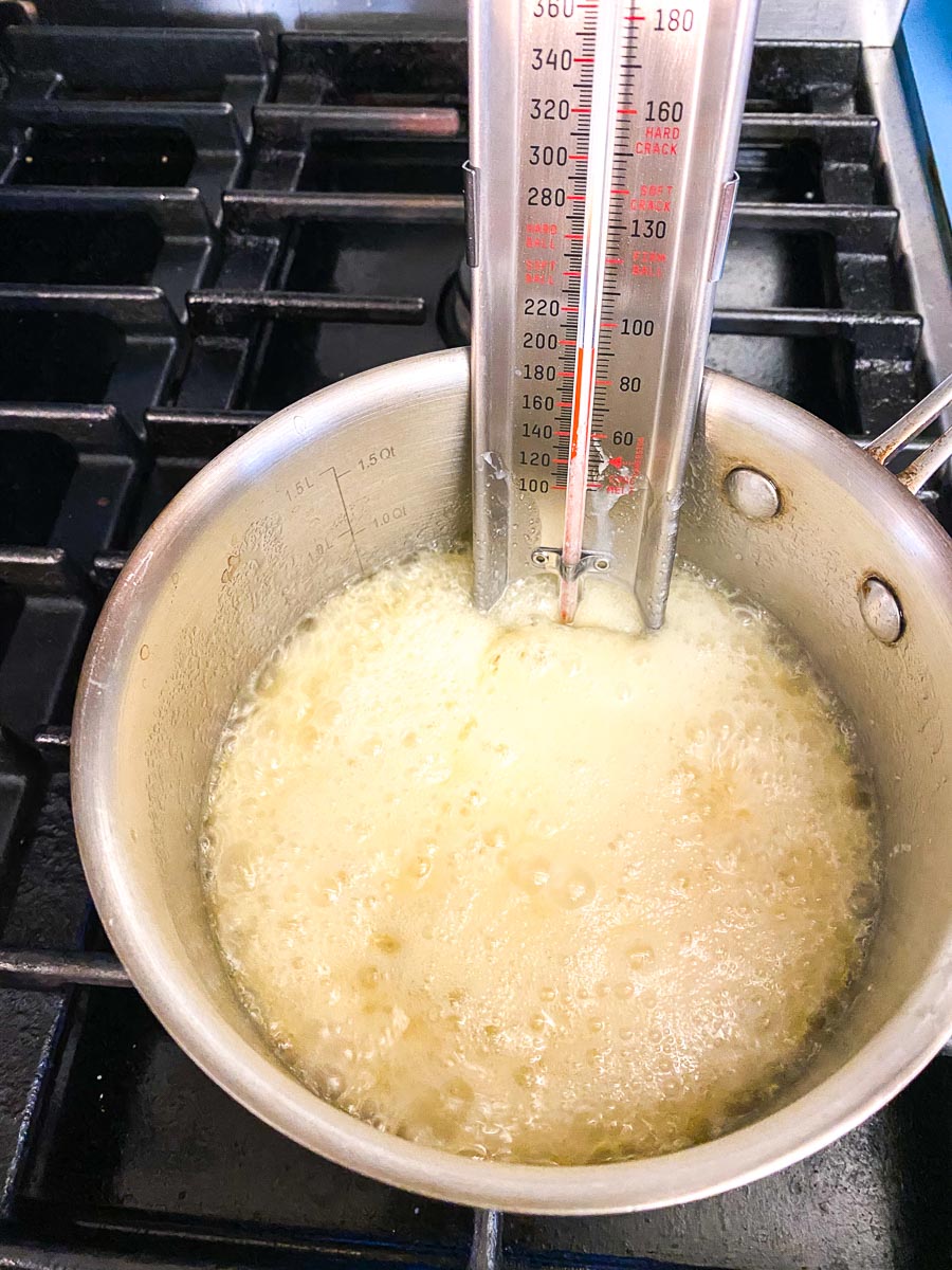 Florentine mixture in pan with candy thermometer