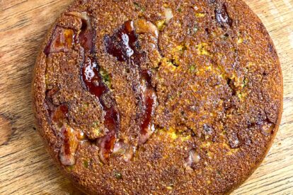Low FODMAP Scallion Bacon Cornbread unmolded out of pan and on wooden board