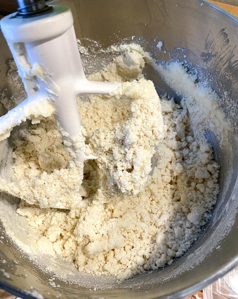 adding dry mixture to shortbread in stand mixer