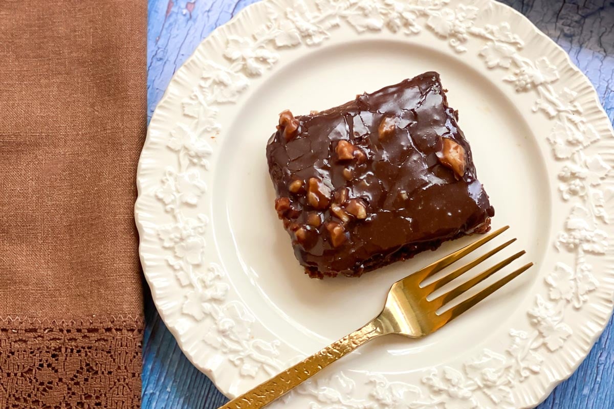 closeup Low FODMAP Texas Sheet Cake square on white plate