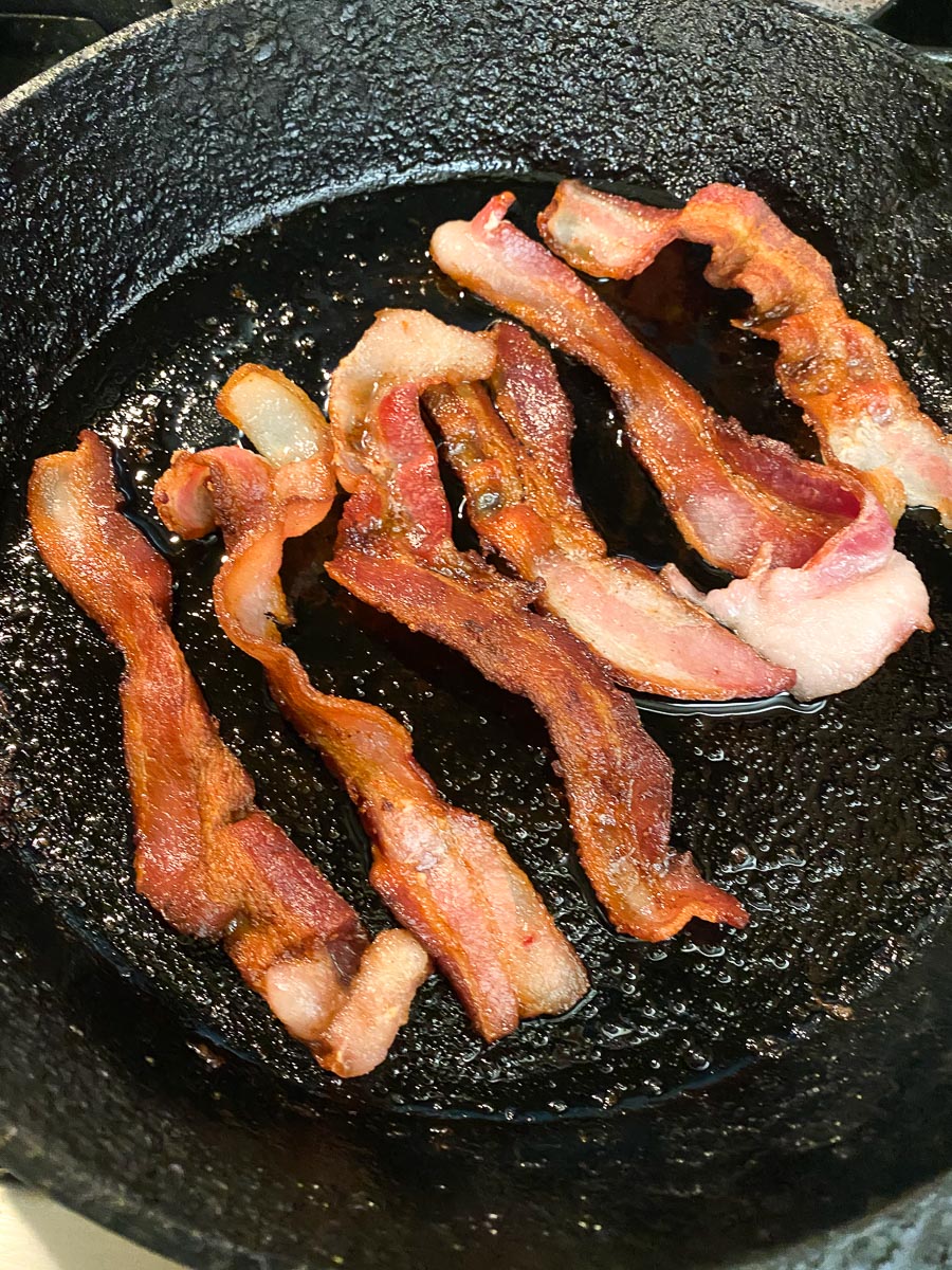 cooked bacon in cast iron pan