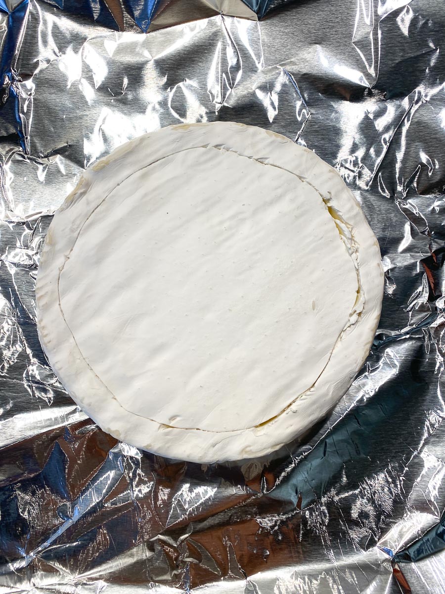 brie on pan, scored on top