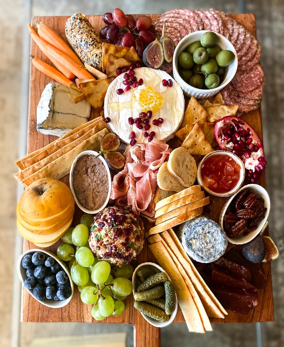 Low FODMAP Charcuterie and Cheese board on coffee table for graphic