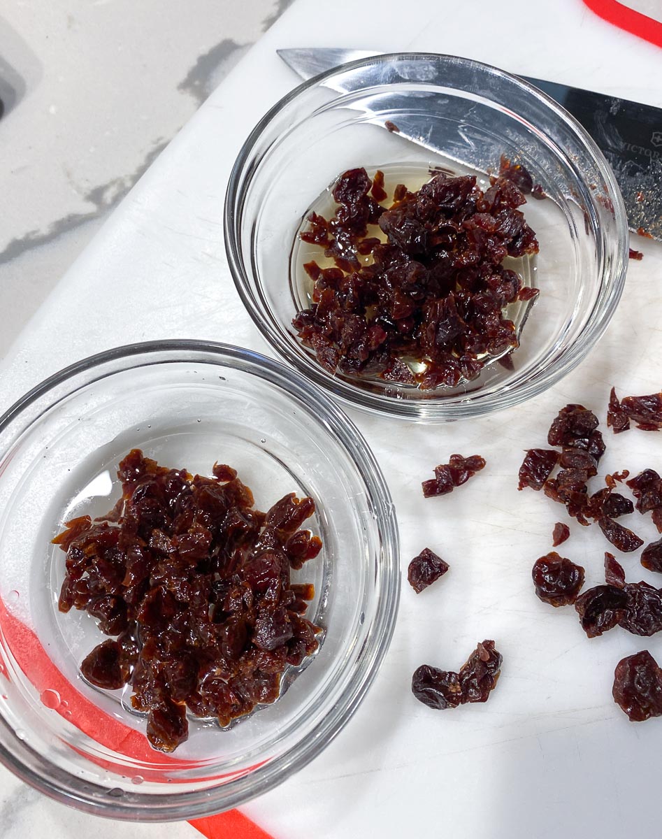 soaking dried fruit in alcohol in glass dishes