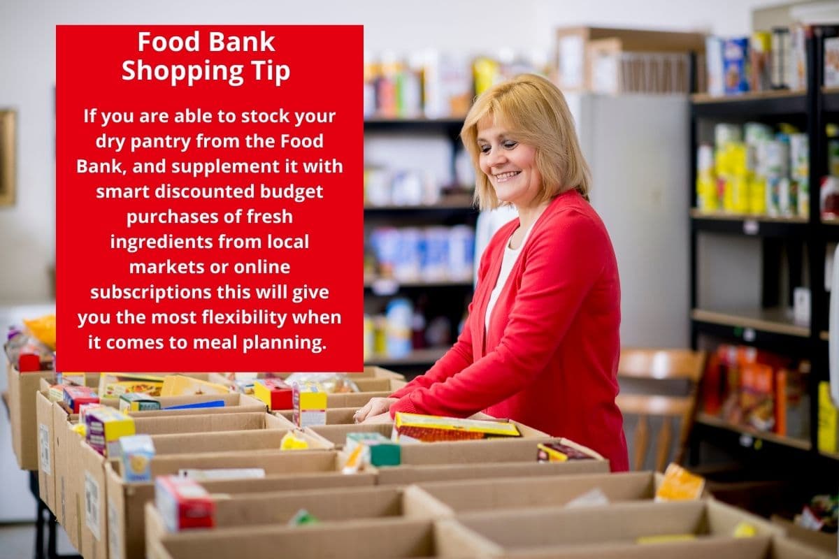 A woman in a bright red sweater sorting food at a food bank. 