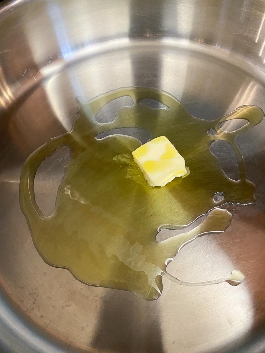 oil and butter in stainless steel pan