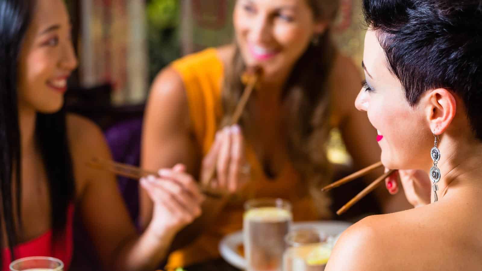 women eating Asian restaurant. kzenon via 123rf