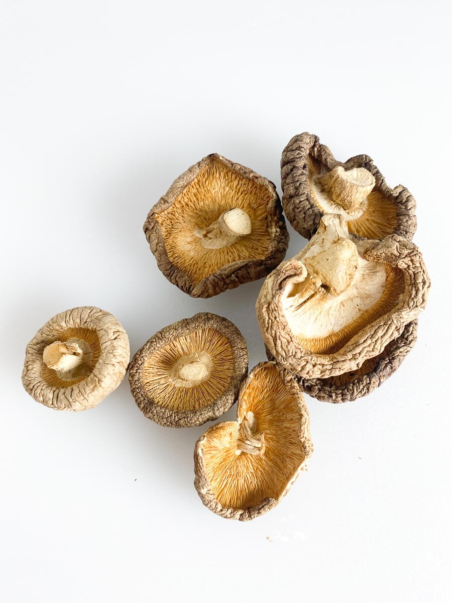 dried shiitake mushrooms on white background