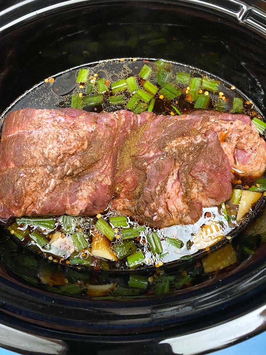 pork and liquid in slow cooker