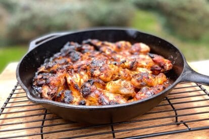 Low FODMAP Hot Honey Chicken Wings in cast iron pan set on rack